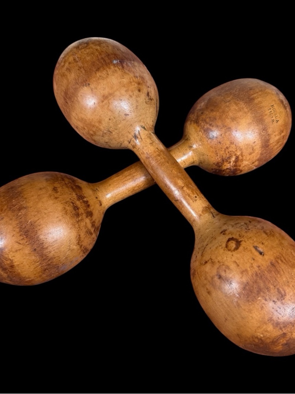 A pair of antique Spalding Model A wooden exercise dumbbells 2lb 11.5” USA